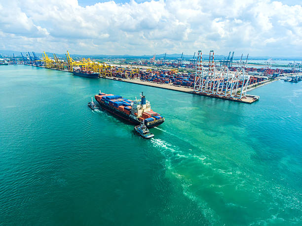 istock container ship in import export and business logistic.By crane , 626632144