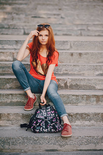 istock three young girls walking in the park 626636736