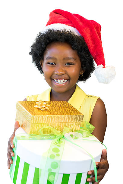 istock African girl holding presents. 626636810