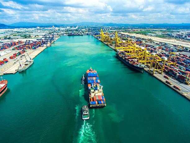 istock container ship in import export and business logistic.By crane , 626636920