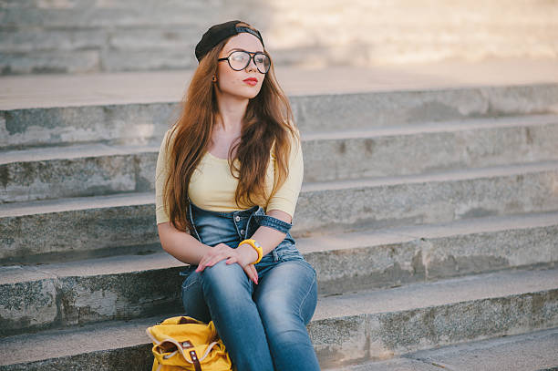 istock three young girls walking in the park 626636950