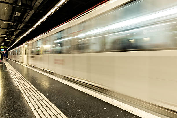 istock Metro train passing thought a station, motion blur 626637842