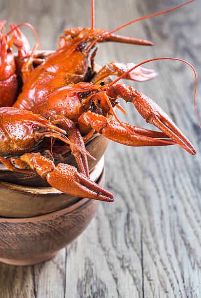 istock Bowl of boiled crayfish on the wooden table 626638428