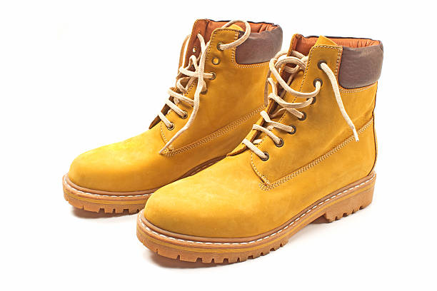 istock New yellow winter boots isolated on white 626639578