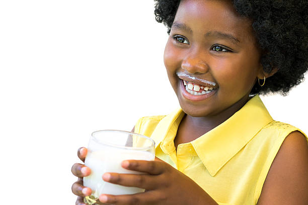 laughing african kid with milk glass. - milk mustache imagens e fotografias de stock