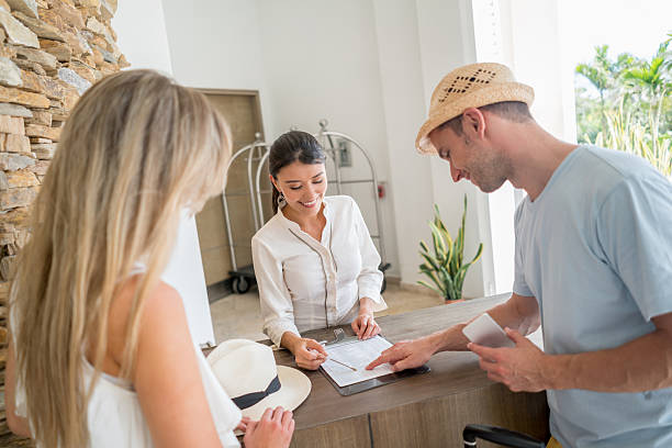 istock Couple doing the check-in at the hotel 626640770