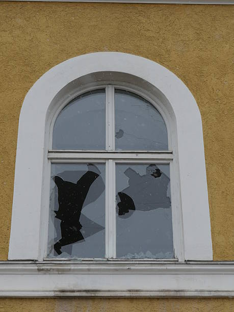 istock Holes in the beaten windowpane 626641782
