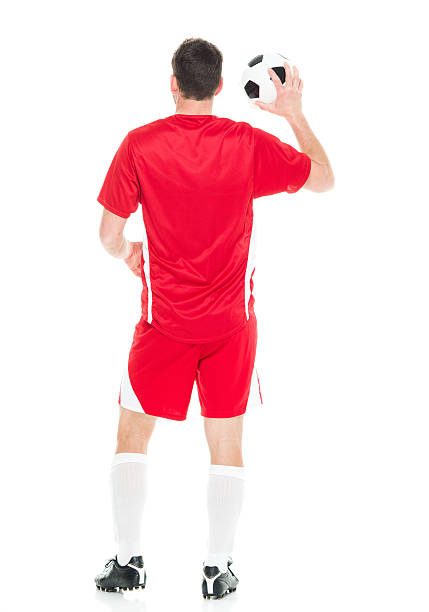 istock Rear view of soccer player holding ball 626644032