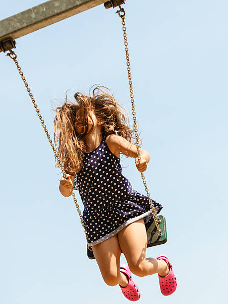 istock Playful crazy girl on swing. 626645724