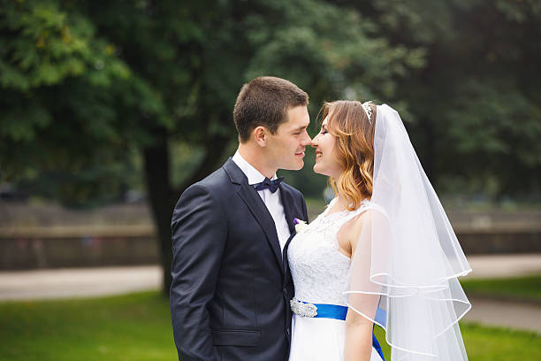 istock Happy wedding couple in a park 626647578