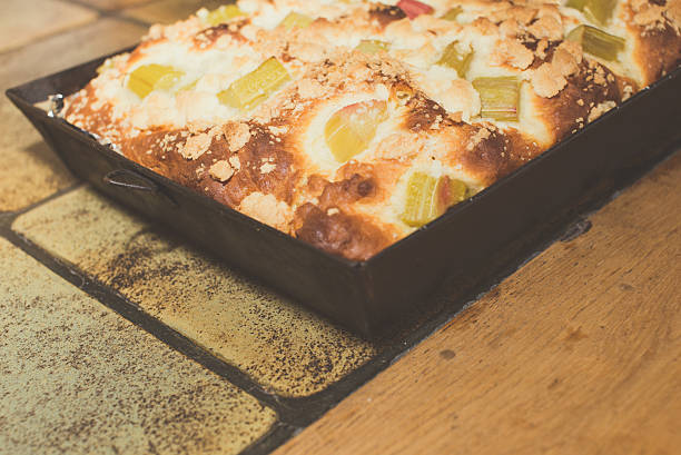 istock rhubarb pie on table, closeup, wood and stone table 626647720