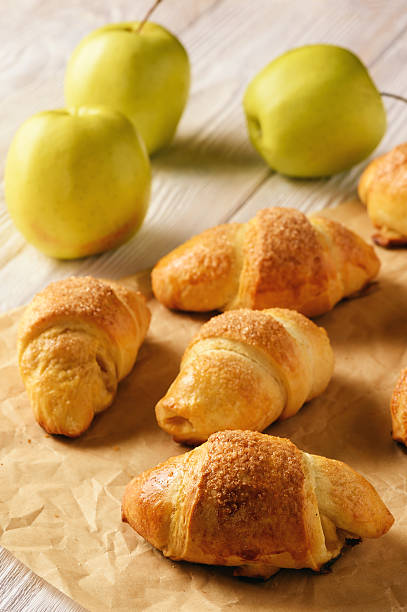 istock Croissants with apple jam on wooden background. 626648394
