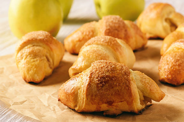 istock Croissants with apple jam on wooden background. 626648532