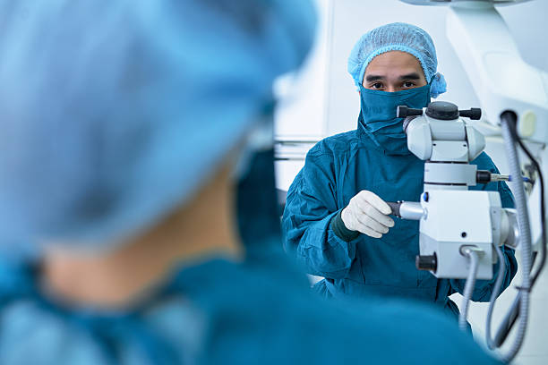 istock Asian doctor using modern medical equipment during surgery 626649194