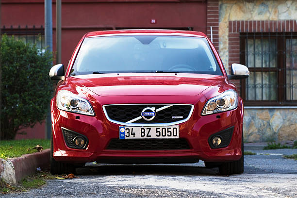 New Red Volvo at The Istanbul Streets Istanbul, Turkey - October 16, 2016: New Red Volvo at the Istanbul Streets in a sunny day in front of houses in a district. There is nobody in the car. volvo photos stock pictures, royalty-free photos & images