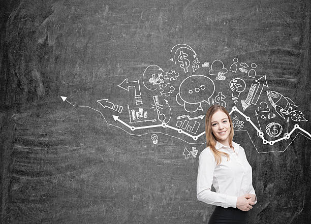 istock Girl with blond hair and graph on blackboard 626655590
