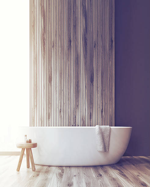 istock Bathroom with a tub and a wooden wall, toned 626655722