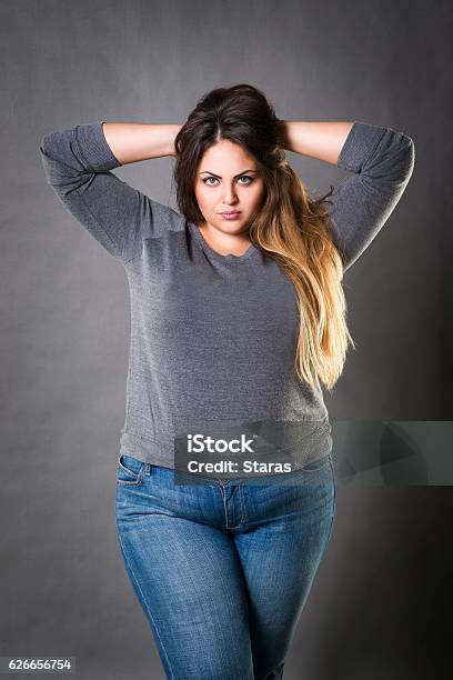 Young Beautiful Plus Size Model In Blue Jeans Xxl Woman Stock Photo -  Download Image Now - iStock
