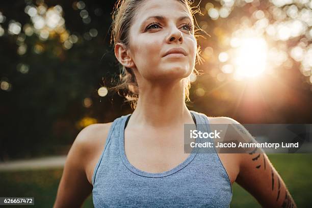Confident Fitness Model In Park Stock Photo - Download Image Now - Women, Confidence, Running