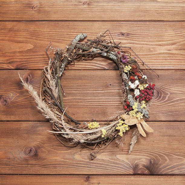 istock Autumn wreath on rustic wooden background 626657478
