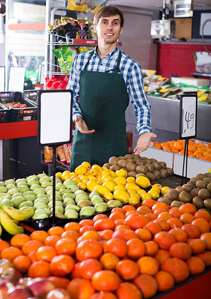 istock young man offering fruits 626659268