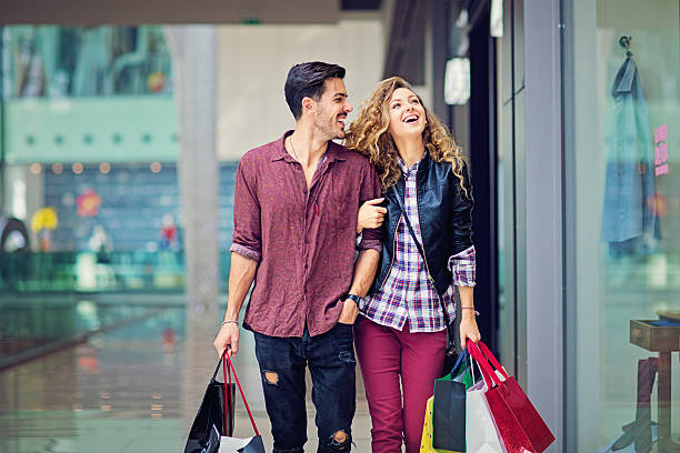 Shopping couple are walking in the Mall stock photo