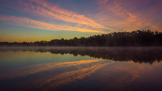 istock Abstract sunrise over water reflection. Ukraine 626661018