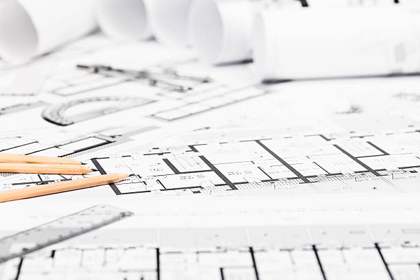 construction plans with drawing tools on blueprints - instrument of measurement organization housing project housing development imagens e fotografias de stock