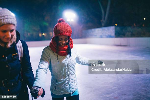 Learning To Iceskate Stock Photo - Download Image Now - Ice Rink, African Ethnicity, Females