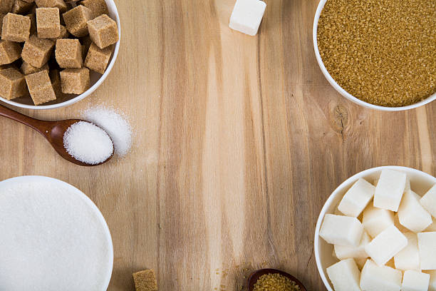 istock Cane and white sugar in a white bowls 626669558