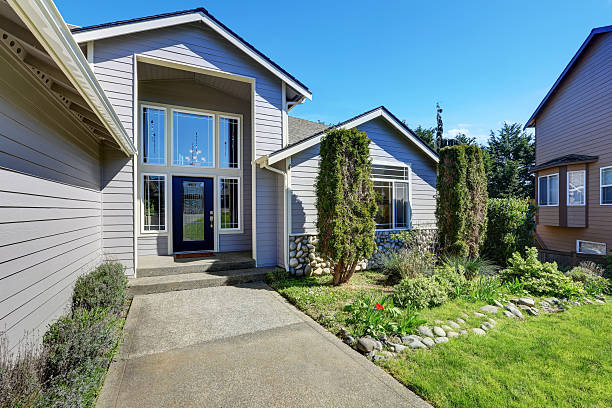 istock Blue siding house with elegant front door and side windows 626669614