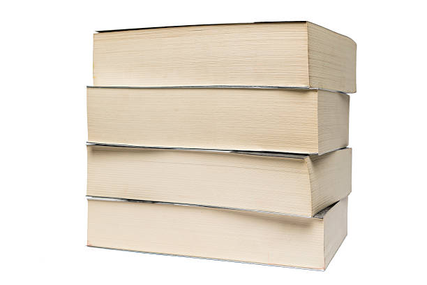 istock Stack of old paperback books isolated on white background 626669810