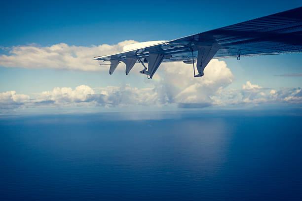 istock airplane wing and seascape 626669856