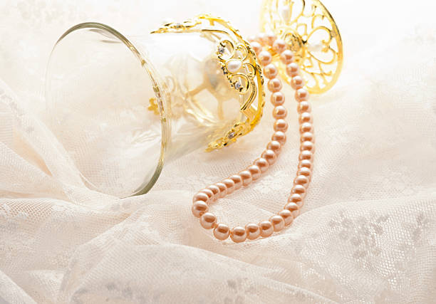 istock Pearl jewellery on lace fabric 626670302