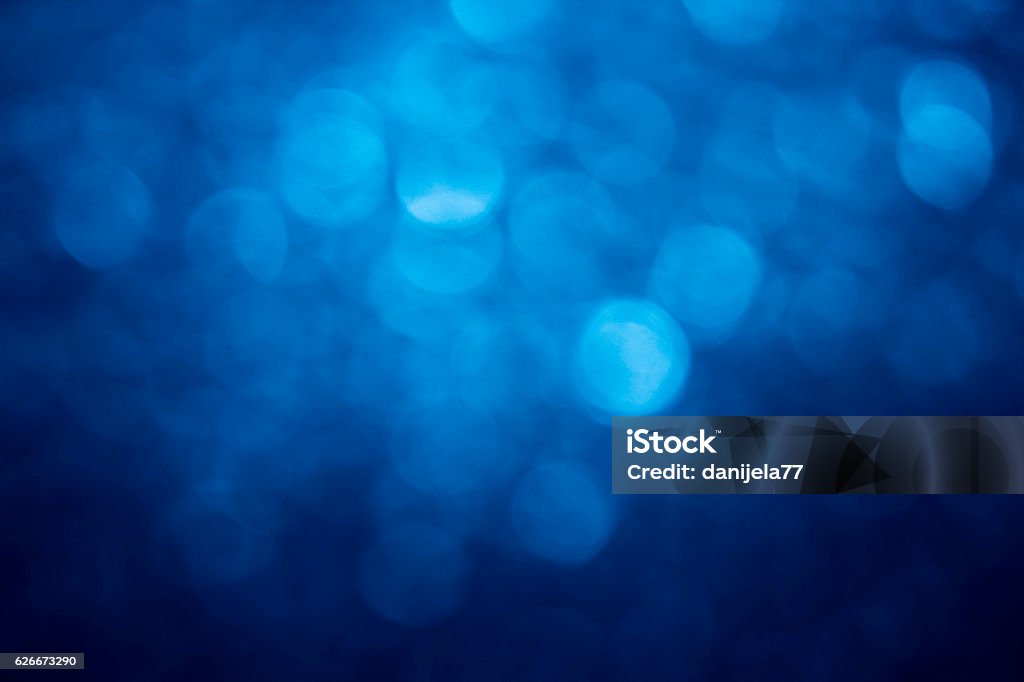bokeh Blue defocused lights Blue Background Stock Photo