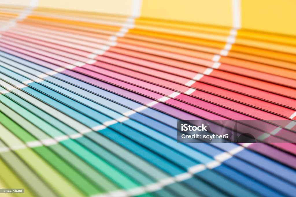 Open Pantone sample colors catalogue. Colour swatches book. Rainbow sample colors catalogue. Color Swatch Stock Photo