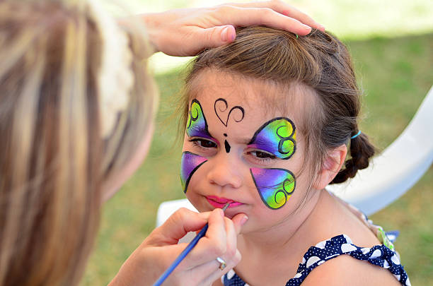 istock Little girl getting her face painted 626674034