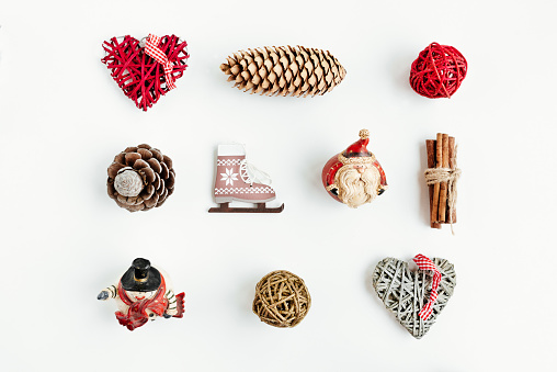 Christmas decorations and objects for mock up template design. Christmas gift box, christmas hearts, cinnamon, cones, ice skating View from above. Flat lay. Xmas decorations.