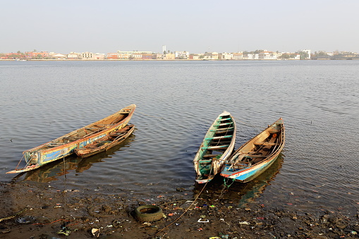 View of South or Sindone district of the city-island from the mainland district of Sor across the river.s Grand Bras-Large Branch downstream from Pont Faidherbe bridge. Ndar or Saint-Louis-du-Senegal.