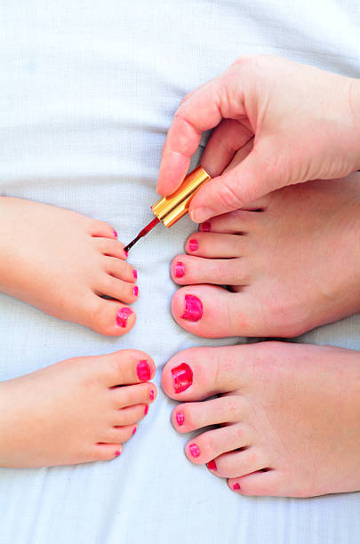 Mother And Child Paint Their Feet With Nail Polish Stock Photo - Download  Image Now - Daughter, Mother, Close-up - iStock
