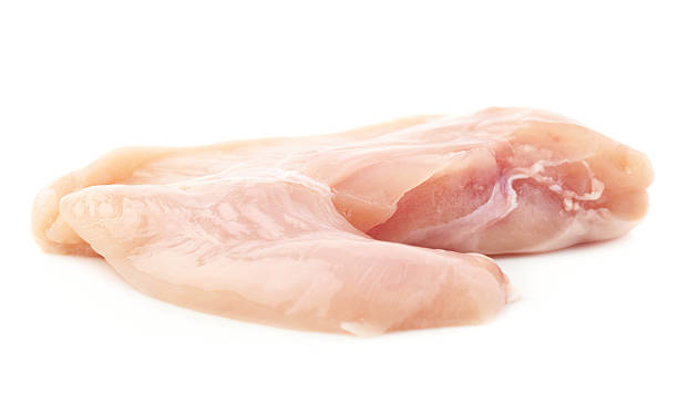 istock Raw chicken fillet isolated over white background 626684796