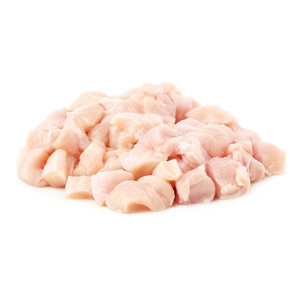 istock Raw chicken fillet cutted into pieces isolated over white background 626684834
