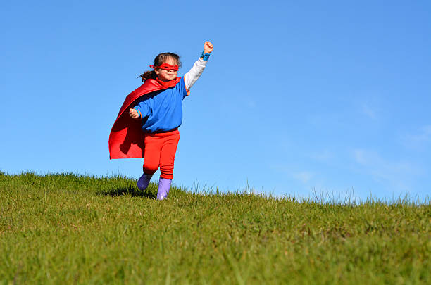 istock Superhero child - girl power 626686398