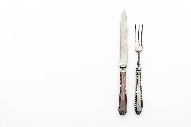 knife and fork isolated on white - beautiful silver cutlery