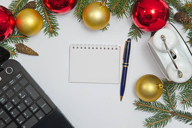istock Blank Notebook page  with laptop, decoration and old clock 626693480