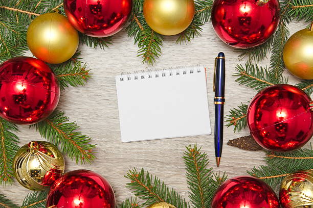 istock Blank Notebook page with christmas decoration on wooden office table 626693904