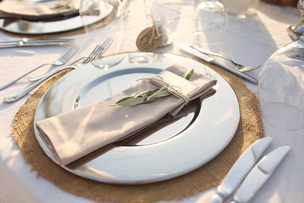 Table setting for an event party or wedding reception Table setting for an event party or wedding reception formal dinning stock pictures, royalty-free photos & images