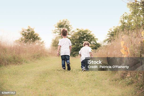 Boys Take Stroll Stock Photo - Download Image Now - Togetherness, Walking, Child