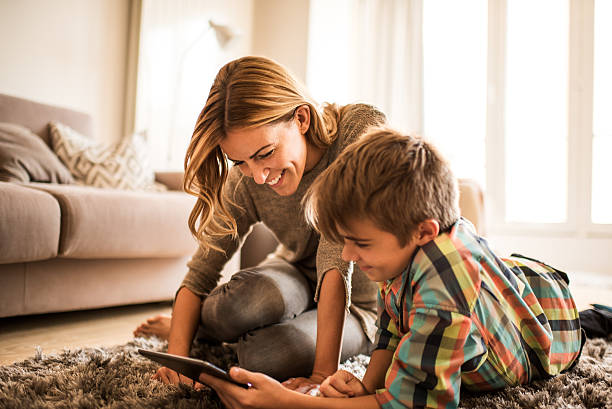 istock Mother and son with digital tablet 626698174