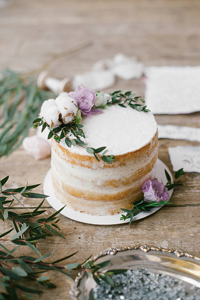 istock Beautiful wedding round cake with floral decorations. 626700422